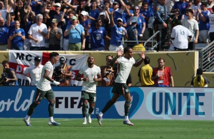 Soccer Football - FIFA Club World Cup - Semi Final - Fluminense v Chelsea - MetLife Stadium, East Rutherford, New Jersey, U.S. - July 8, 2025 Chelsea's Joao Pedro celebrates scoring their second goal with Chelsea's Enzo Fernandez and Chelsea's Christopher Nkunku REUTERS/Hannah Mckay