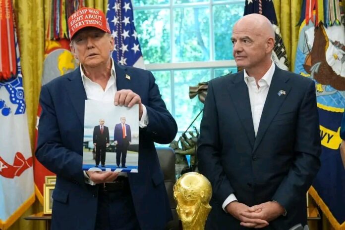 US president Donald Trump holds a photo of himself with Russian president Vladimir Putin during an announcement in the Oval Office of the White House on Friday. Photograph: Chip Somodevilla/Getty Images