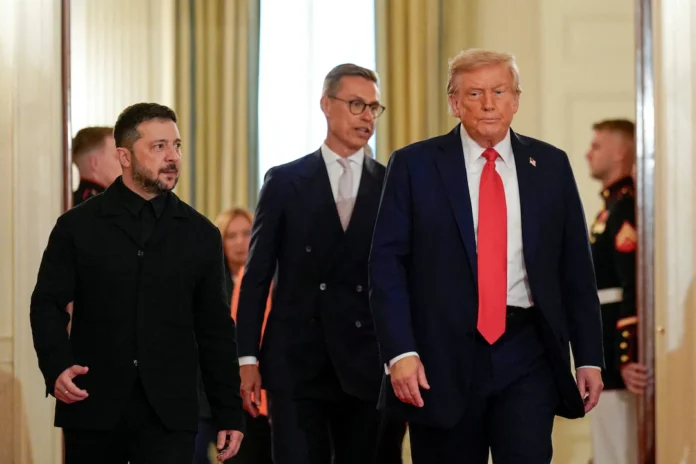 U.S. President Donald Trump and Ukrainian President Volodymyr Zelenskiy walk during a meeting, amid negotiations to end the Russian war in Ukraine, at the White House in Washington, D.C., U.S., August 18, 2025. REUTERS/Alexander Drago