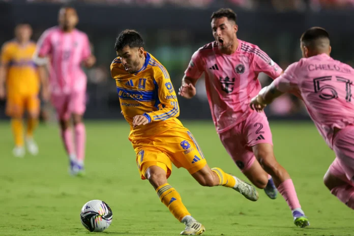 Aug 20, 2025; Fort Lauderdale, Florida, USA; Tigres UANL forward Angel Correa (7) dribbles the ball past Inter Miami CF defender Gonzalo Lujan (2) and defender Marcelo Weigandt (57) before scoring during the second half at Chase Stadium. Mandatory Credit: Sam Navarro-Imagn Images