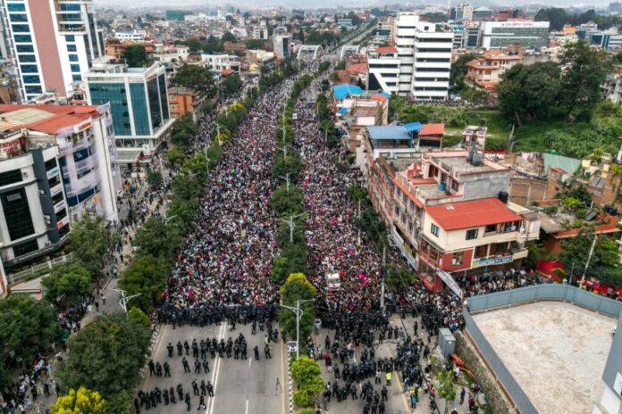 An aerial view shows demonstrators gathered outside Nepal's Parliament during a protest in Kathmandu on September 8, 2025, condemning social media prohibitions and corruption by the government. (Photo by PRABIN RANABHAT / AFP)