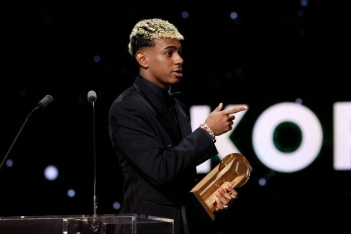 Barcelona's Spanish forward Lamine Yamal reacts after receiving the Kopa Trophy for the best under-21 player during the 2025 Ballon d'Or France Football award ceremony at the Theatre du Chatelet in Paris on September 22, 2025. (Photo by Franck FIFE / AFP)