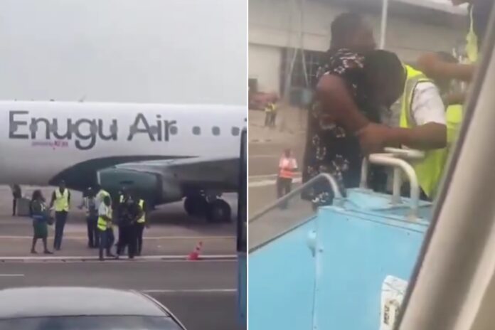 The yet-to-be-identified passenger struggling with the Enugu Air officials…Credit: Screenshot of video