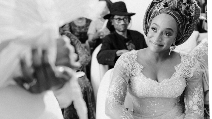 DJ Cuppy starring at her sister, Temi Ajibade at her wedding ceremony. Image: cuppymusic/X