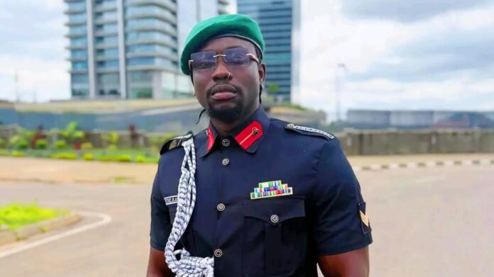 VeryDarkMan in a fake security outfit