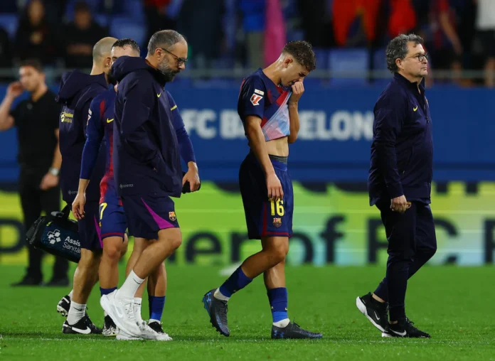 Soccer Football - LaLiga - FC Barcelona v Getafe - Johan Cruyff Stadium, Barcelona, Spain - September 21, 2025 FC Barcelona's Fermin Lopez reacts after sustaining an injury after the match REUTERS/Albert Gea