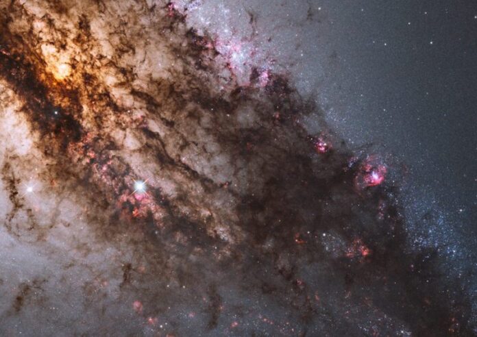 Dark lanes of dust crisscross the giant elliptical galaxy Centaurus A in this image from NASA’s Hubble Space Telescope. Image via NASA, ESA and the Hubble Heritage (STScI/AURA)-ESA/Hubble Collaboration.