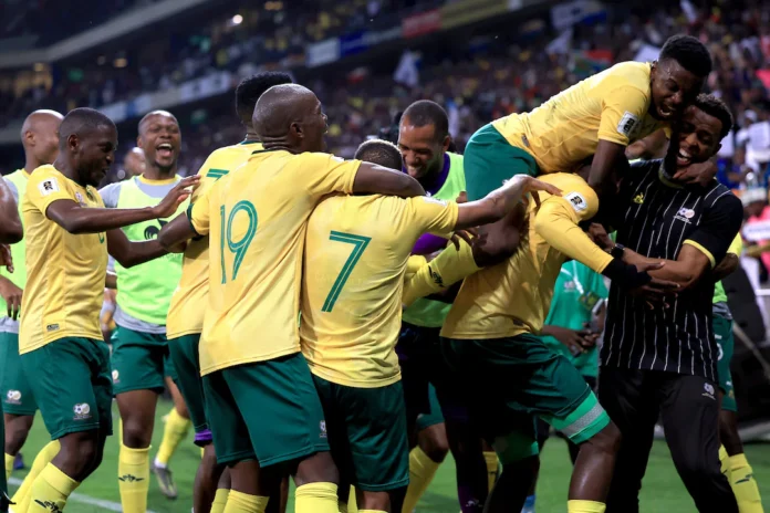 Soccer Football - FIFA World Cup - CAF Qualifiers - Group C - South Africa v Rwanda - Mbombela Stadium, Mbombela, South Africa - October 14, 2025 South Africa's Evidence Makgopa celebrates scoring their third goal with teammates REUTERS/Esa Alexander