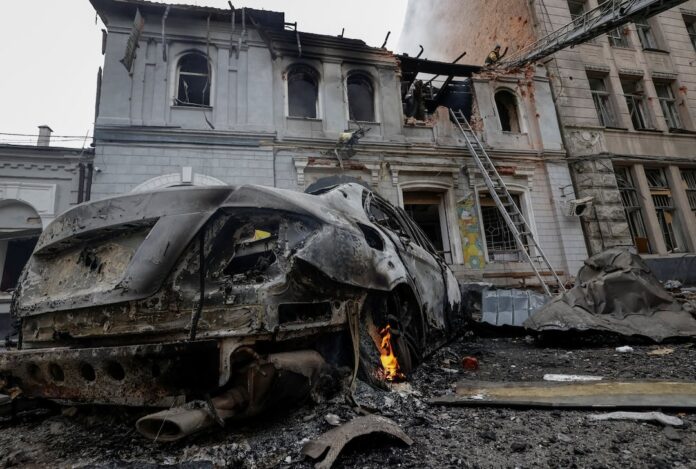 Firefighters work at the site of the kindergarten hit by a Russian drone strike, amid Russia's attack on Ukraine, in Kharkiv, Ukraine, October 22, 2025. REUTERS/Sofiia Gatilova