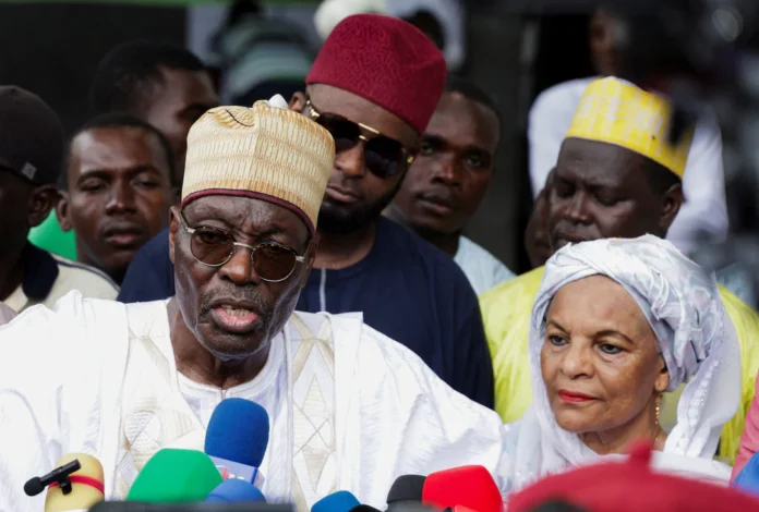 Presidential candidate Issa Tchiroma Bakary of the Cameroon National Salvation Front (FSNC) speaks to the media after casting his vote on the day of Cameroon’s presidential election at the polling station of Ecole Maternelle de Foulbere in Garoua, Cameroon, October 12, 2025. REUTERS/Desire Danga Essigue