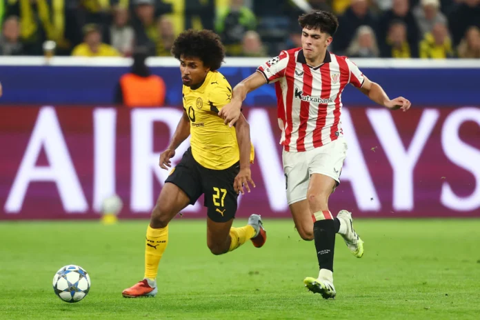 Soccer Football - UEFA Champions League - Borussia Dortmund v Athletic Bilbao - Signal Iduna Park, Dortmund, Germany - October 1, 2025 Borussia Dortmund's Karim Adeyemi in action with Athletic Bilbao's Alejandro Rego REUTERS/Leon Kuegeler