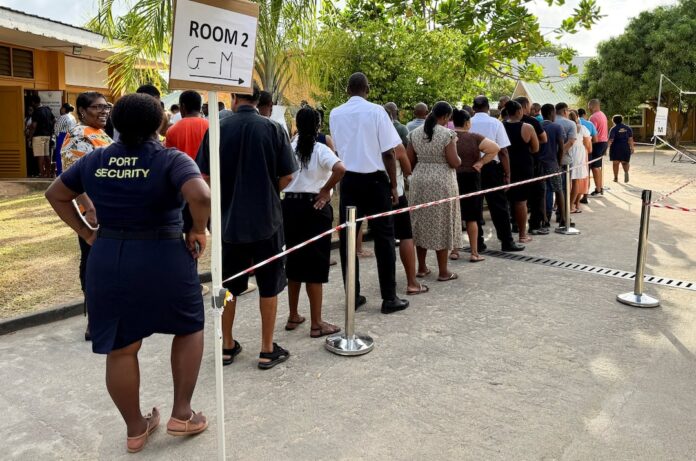 People queue to cast their ballots during the presidential runoff election, after no candidate secured the required 50% majority in the first round held on September 27, in Victoria, Seychelles, October 9, 2025. REUTERS/Gabriel Robert-Gironcelle