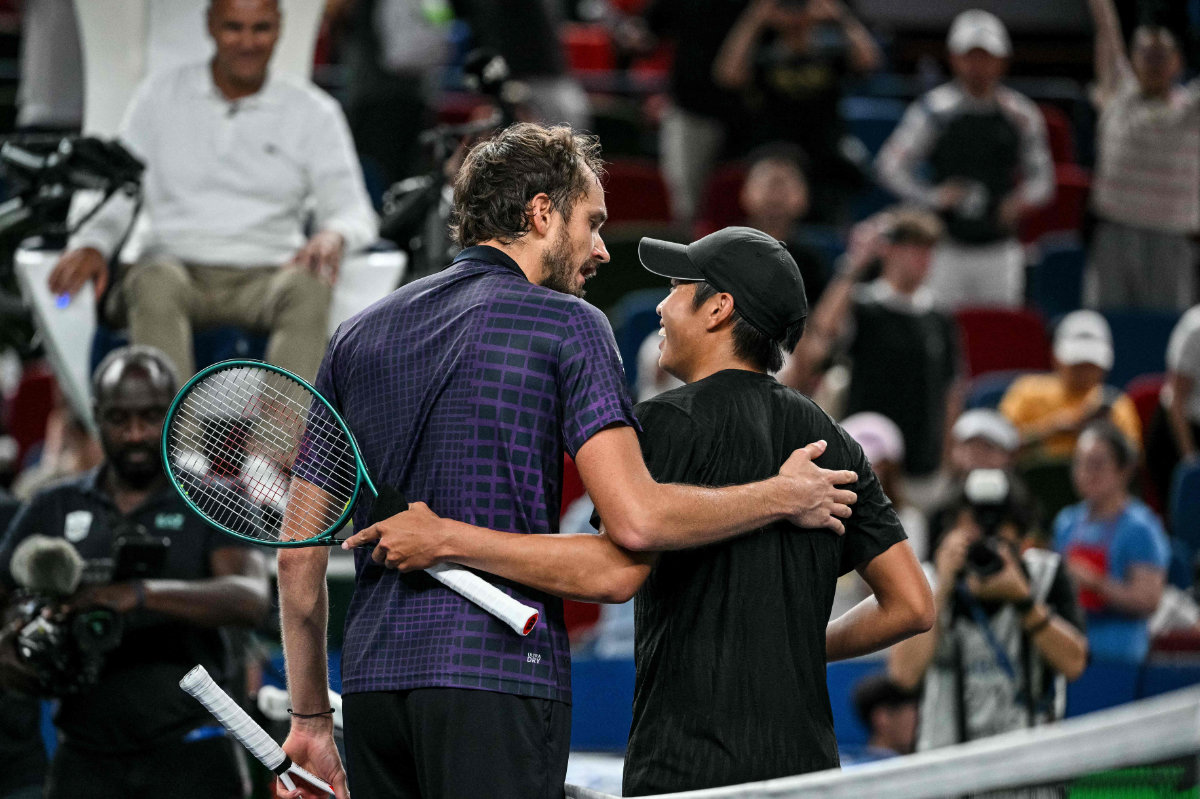 Daniil Medvedev (L) embraces Learner Tien at the end of their men's singles match at the Shanghai Masters tennis tournament in Shanghai on October 8, 2025. (AFP)