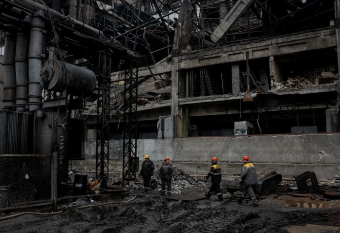 Employees work at a thermal power plant damaged by a recent Russian missile strike, amid Russia's attack on Ukraine, in an undisclosed location of Ukraine, November 13, 2025. REUTERS/Gleb Garanich