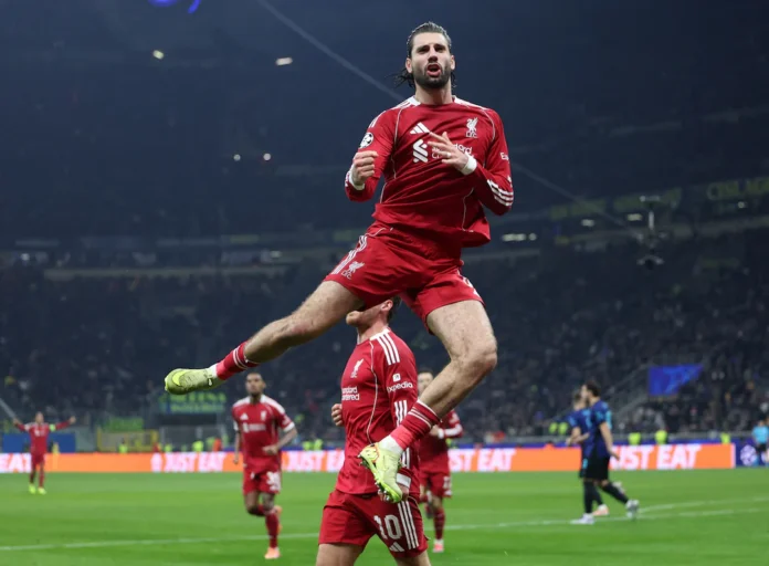 Soccer Football - UEFA Champions League - Inter Milan v Liverpool - San Siro, Milan, Italy - December 9, 2025 Liverpool's Dominik Szoboszlai celebrates scoring their first goal with Liverpool's Alexis Mac Allister REUTERS/Claudia Greco