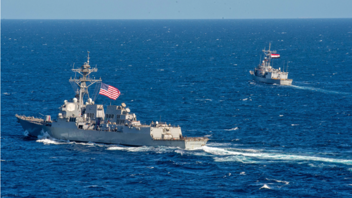 This file handout picture released by the US Naval Forces Central Command/US 5th Fleet on Feb 7, 2022 shows US Navy guided-missile destroyer USS Jason Dunham (DDG 109) (left) and Egyptian Navy frigate ENS Alexandria (F911) conducting maneuvering-operation exercises in the Red Sea during the International Maritime Exercise/Cutlass Express. (PHOTO / UNITED STATES NAVAL FORCES CENTRAL COMMAND / AFP