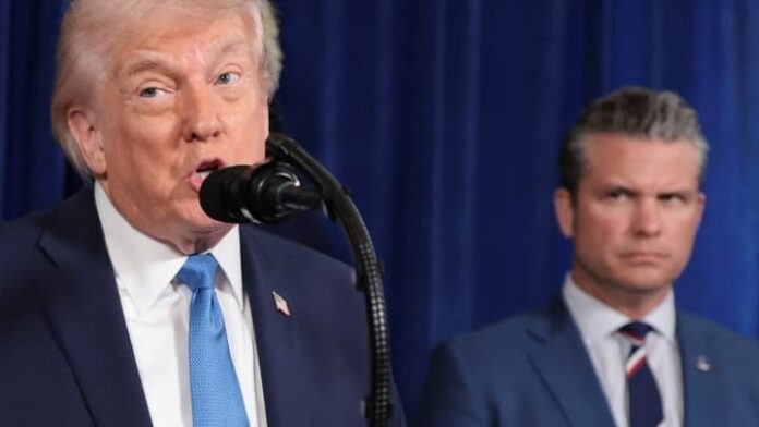 U.S. President Donald Trump holds a press conference as Secretary of Defense Pete Hegseth looks at him following a U.S. strike on Venezuela where President Nicolas Maduro and his wife, Cilia Flores, were captured, from Trump's Mar-a-Lago club in Palm Beach, Florida, U.S., January 3, 2026. Jonathan Ernst | Reuters