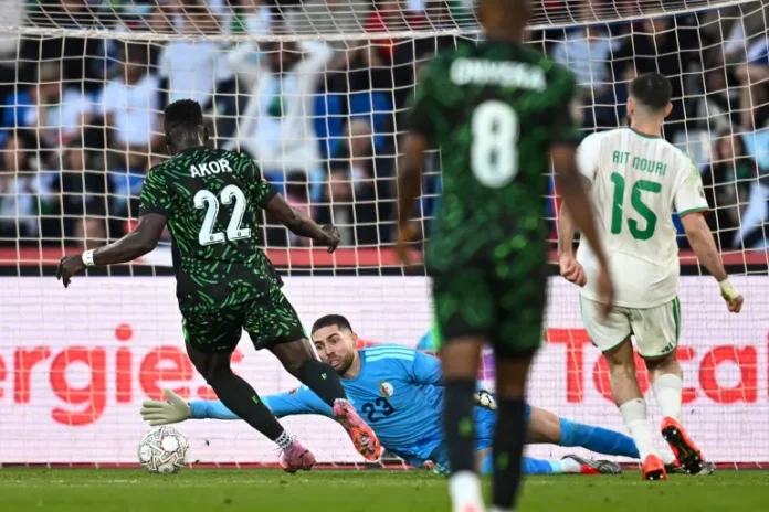 Akor Adams scores Nigeria’s second goal past Algeria’s goalkeeper Luca Zidane [AFP]