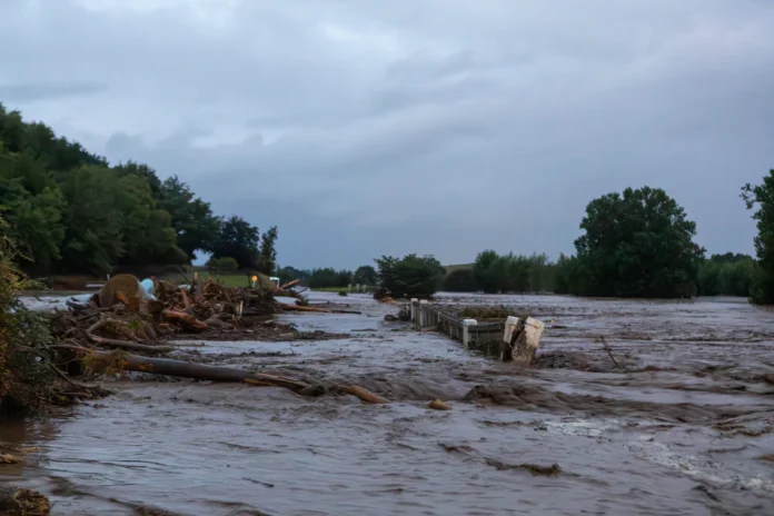 Floodwaters cover the road after heavy rain and wild winds in Puketotara, Waikato region, New Zealand, February 13, 2026, in this picture obtained from social media. Wayne Feisst/via REUTERS Purchase Licensing Rights