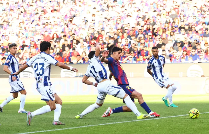 Soccer Football - LaLiga - FC Barcelona v Levante - Spotify Camp Nou, Barcelona, Spain - February 22, 2026 FC Barcelona's Marc Bernal scores their first goal. REUTERS/Albert Gea