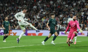 Soccer Football - UEFA Champions League - Round of 16 - First Leg - Real Madrid v Manchester City - Santiago Bernabeu, Madrid, Spain - March 11, 2026 Real Madrid's Federico Valverde scores their third goal to complete a hat-trick REUTERS/Violeta Santos Moura