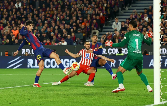 Soccer Football - Copa del Rey - Semi Final - Second Leg - FC Barcelona v Atletico Madrid - Spotify Camp Nou, Barcelona, Spain - March 3, 2026 FC Barcelona's Marc Bernal scores their third goal as Atletico Madrid's Juan Musso attempts to make a save REUTERS/Albert Gea