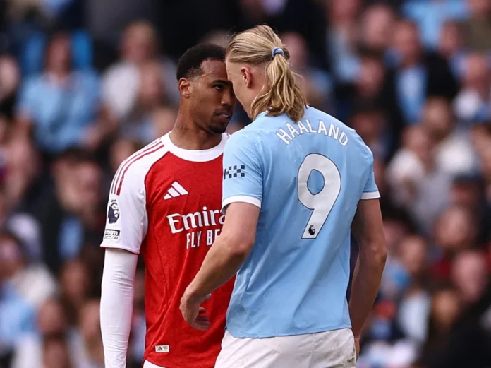 Soccer Football - Premier League - Manchester City v Arsenal - Etihad Stadium, Manchester, Britain - April 19, 2026 Arsenal's Gabriel Magalhaes clashes with Manchester City's Erling Haaland Action Images via Reuters/Lee Smith