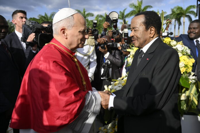 Pope Leo XIV (left) is greeted by Cameroonian President Paul Biya, at the Presidential Palace in Yaounde, Cameroon, Wednesday. (EPA-Yonhap)