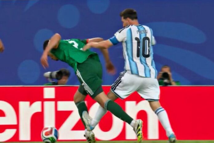 Lionel Messi avoided a red card for a robust challenge on Algeria defender Aïssa Mandi