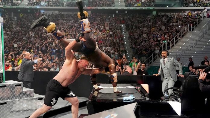 Brock Lesnar delivers an F5 to Oba Femi on an announce table during Clash in Italy at Inalpi Arena in Torino di Sangro, Italy, on May 31, 2026. (Rich Freeda/WWE)