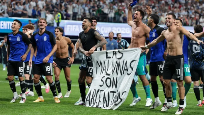 Argentine players display the Falklands banner after the game. Photo: Getty Images