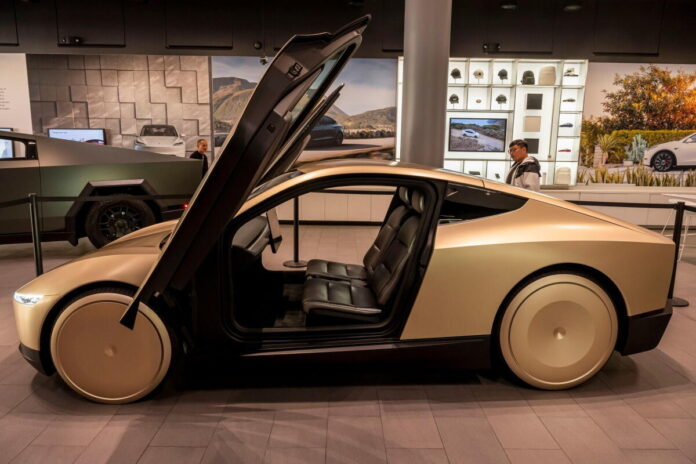 A Tesla Cybercab prototype at a Tesla store in San José, Calif.   (Bloomberg)