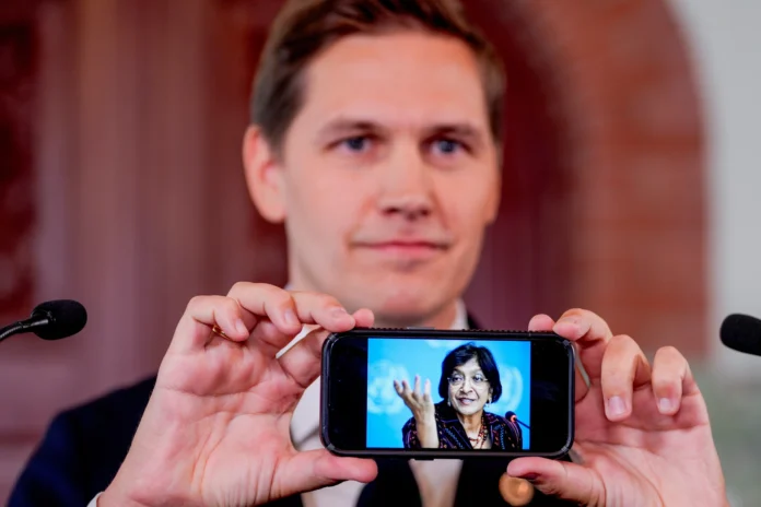 The Chairman of the Nobel Committee, Jørgen Watne Frydnes, shows a photograph of 2026 Nobel Peace Prize laureate Navanethem Pillay after the announcement at the Nobel Institute in Oslo, Norway on Oct. 9, 2026. (NTB Scanpix via AP)