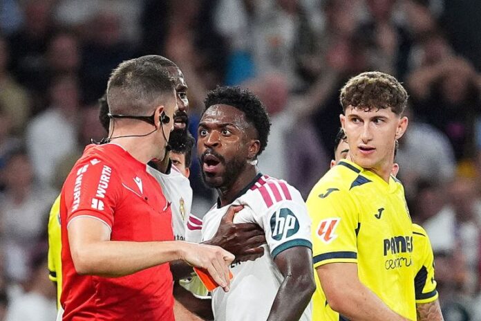 Vinicius Junior of Real Madrid receives a red card from referee Isidro Diaz de Mera Escuderos [Angel Martinez/Getty Images]